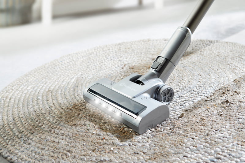 closeup cordless stick vacuum cleaner on a rug